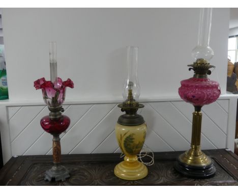 A Victorian brass column Duplex Oil Lamp, having a painted opaque pink font and Duplex burner, raised on plinth base, H 64cm 