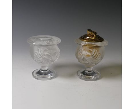 A Lalique frosted glass Lion's Head Table Lighter and Cigarette Pot, each with corresponding design, etched signature to base