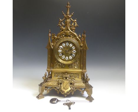A late 19th century French gilt brass Gothic revival style Mantel Clock, the architectural case with circular dial and cerami
