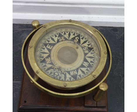 A late 19thc/early 20thc brass cased liquid filled Marine Compass, by J. W. Searby &amp; Son, Lowestoft, with gimble mounting