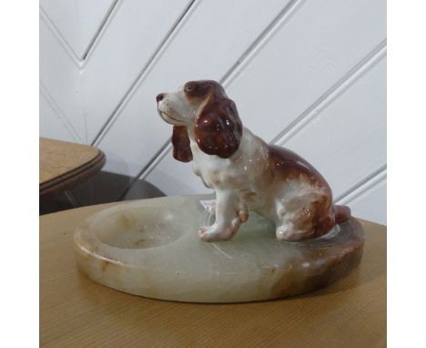 An early 20thC onyx and ceramic spaniel Ashtray, 19cm long, together with eight pieces of Poole Pottery to include five Egg C