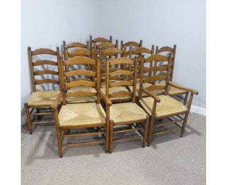 A set of twelve early 20thC oak ladder-back Dining Chairs, made up of two carver chairs with elbow rests and ten dining chair