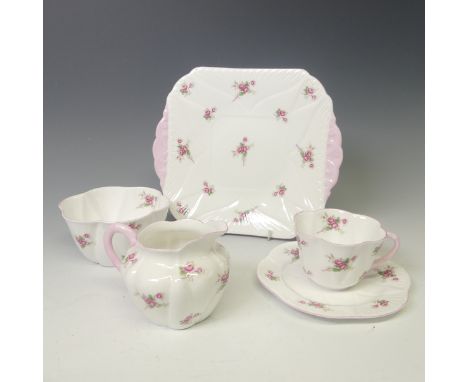 A Shelley 'Bridal Rose' pattern Tea Set, comprising six Cups and Saucers, Tea Plates, one broken, Cake Plate, Cream Jug and S