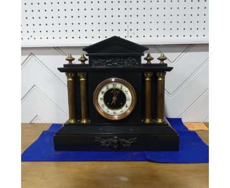 A late Victorian black slate Mantel Clock, of architectural form with gilt metal columns and finials, 35cm wide x 32cm high. 
