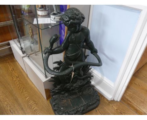 A Victorian cast iron Stick Stand, in the form of young Hercules holding a serpent and standing on a grassy base, the removab