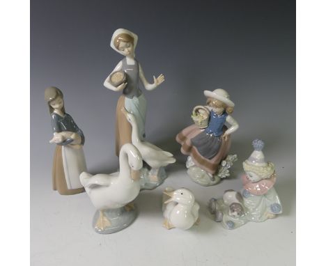 A small quantity of Lladro Figures, to comprise Goose Girl, Young Girl Carrying Basket, Seated Clown Puppy and Girl Carrying 