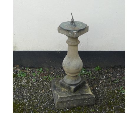 Garden Statuary; a reconstituted stone baluster with associated decorative metal sundial, W 32cm x H 74cm x D 32cm. 