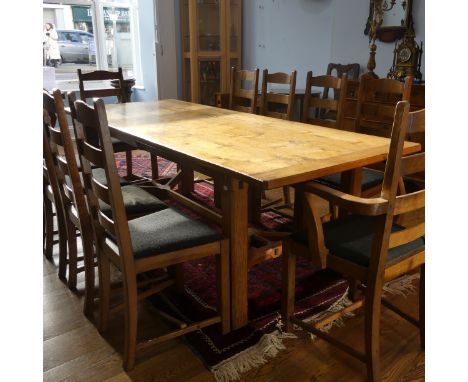 A craftsman made oak table with peg construction, table top made of 5 planks together with cleated ends and butterfly joints,