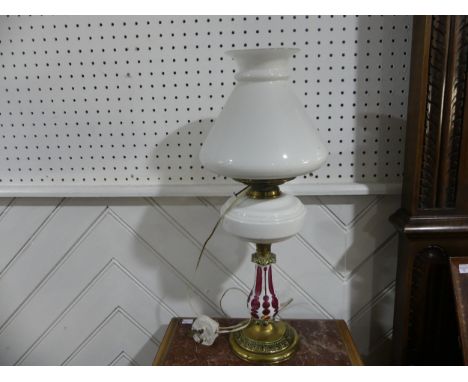 A Victorian overlaid glass Oil Lamp, converted to electricity, with shade, on brass base, H 55cm. 