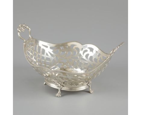 Oval model with soldered handles, pearl rim decoration, openwork sides and standing on 4 soldered claw feet. The Netherlands,