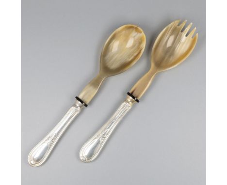 Executed with filled silver handles with repoussé decoration and horn bowls. Italy, Padova, 20th century, hallmarks: 800, cit
