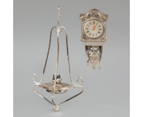 Consisting of an oil lamp and a wall clock. The Netherlands, Schoonhoven, H. Hooijkaas, 20th century, hallmarks: various hall