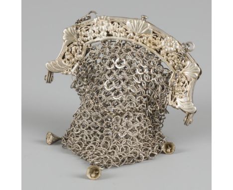 Equipped with chain mail pouch with mounted bells. Bracket openwork with repoussé decorations. The Netherlands, Leeuwarden, P
