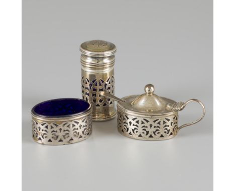 Set consisting of a caster, salt cellar and mustard pot with spoon. All with openwork sides and blue glass inserts. USA, Birk