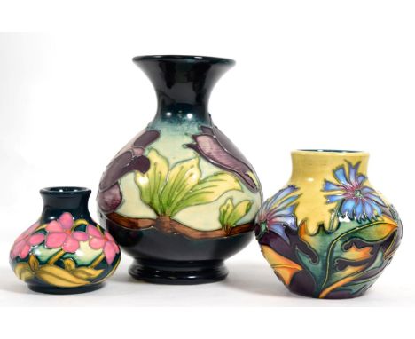 Moorcroft pottery: a group of three vases, Wine Magnolia designed by Walter Moorcroft, 14cm high; Chicory, from the Herb coll