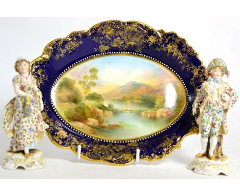 A 19th century cabinet dish Loch Katrine and a pair of Continental figures (3)Cabinet plate: restored, figures: hand lacking 