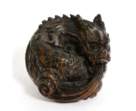 A Japanese carved wood netsuke modelled as a dragon, signed  