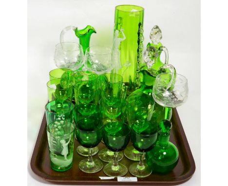 A green glass Mary Gregory style vase and tumbler, together with further green glass including a pair of decanter jugs, wines