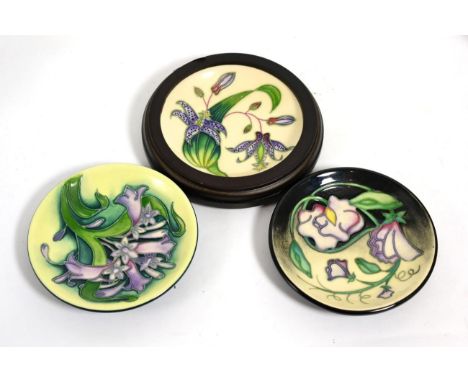 Moorcroft pottery; three coasters, Day Dream by Sian Leeper, Toad Lily by Philip Gibson, Isis by Emma Bosson (each boxed and 