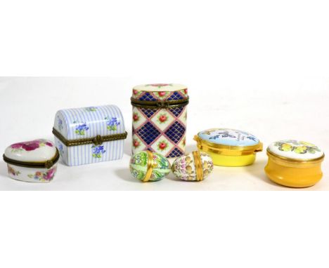 Two Halcyon Days enamel boxes, two further eggs and three other porcelain boxes (7)