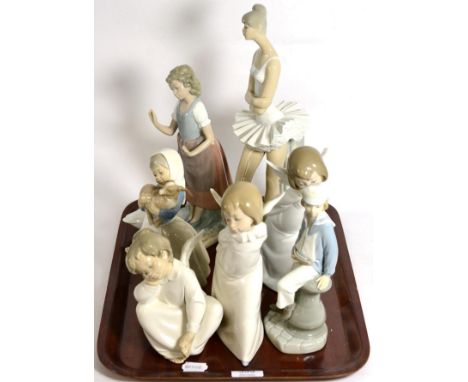 A group of four Lladro figures and three Nao examples (7)