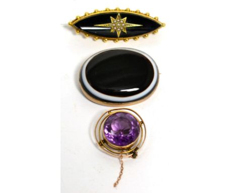 A onyx and seed pearl brooch, an amethyst brooch and a sardonyx brooch (a.f.)