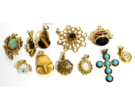 A 9ct gold tiger's eye pendant, a 9ct gold jade pendant, eight other pendants and a hardstone swivel fob 