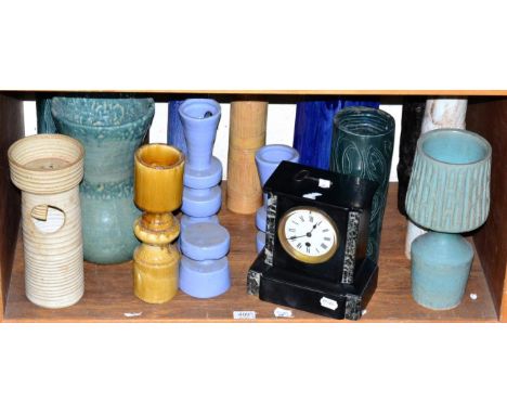 An inlaid barometer with a silvered dial, a black marble mantel time piece and a collection of Studio Pottery vases (one shel