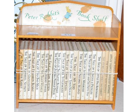 Peter Rabbits book shelf with twenty three volumes 