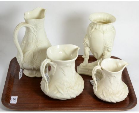Two Parian lilly pattern jugs stamped 'Livesley Powell & Co', another Parian jug and a tripod vase (4)