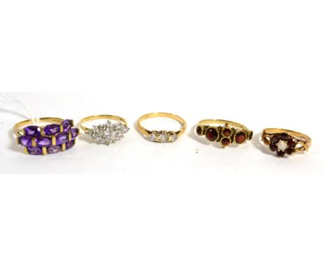 A 9ct gold amethyst ring, finger size Q1/2 and four other 9ct gold gem set rings (5)Gross weight 12.4 grams 