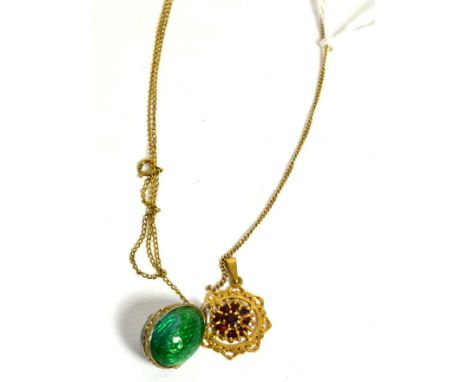 An enamel egg pendant on chain, a 9ct gold pearl set pendant, and a 9ct gold garnet pendant on chain (3)