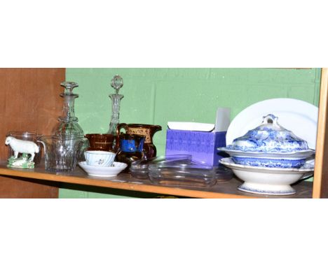 A shelf of assorted ceramics and glass 