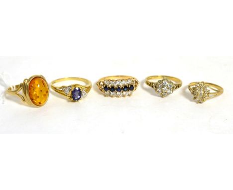 A 9ct gold amber ring, finger size R and four other 9ct gold gem set rings (5)Gross weight 13.4 grams 