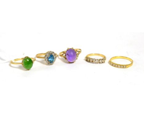 A jade ring, finger size Q, a 9ct gold cabochon amethyst ring, finger size R/12 and three 9ct gold gem set rings (5)Gross wei