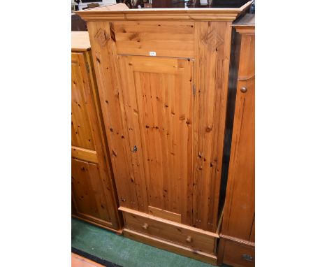 A 20th century pine single door wardrobe of large proportions. 202cm high x 97cm wide x 56cm deep.