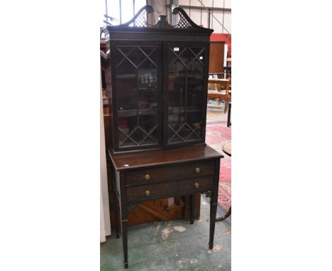 An Edwardian Chinese Chippendale revival display cabinet, fretworked broken swan neck pediment, two astragal glazed doors to 