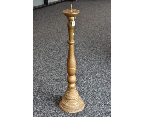 A 19th century giltwood floor standing pricket candlestick, domed sconce, turned column, stepped base, 110cm high 