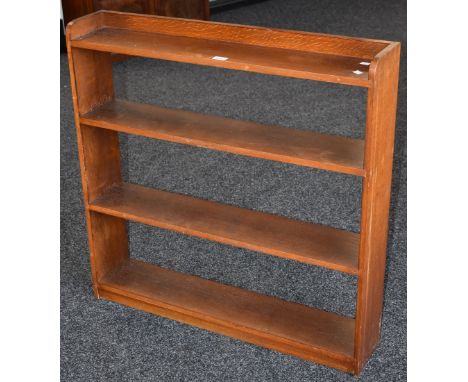 A four shelf floor standing oak bookcase