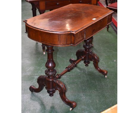 A Victorian rosewood bowed rectangular library table, of small proportions, moulded top above a long frieze drawer, turned en