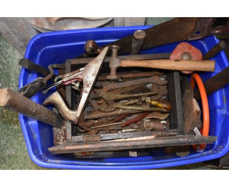 A box of tools to include planes, hammers, saws, etc 