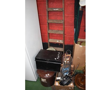An Alladin paraffin heater; a paraffin can; an enamel bread bin; a brass jam pan; vintage clip on ice skates; a vintage thatc