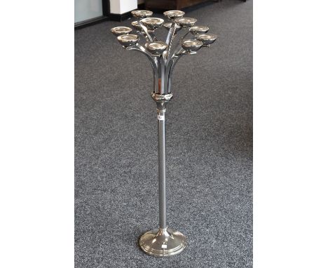 A floor standing twelve branch tea light holder, stepped foot