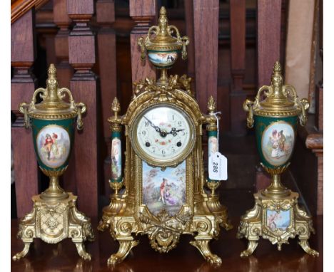 A gilt brass three piece clock garniture, inset porcelain panels