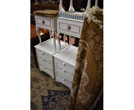 A pair of Rococo revival bedside tables; a modern pair of three drawer bedside chests; a dressing table stool; a giltwood tri