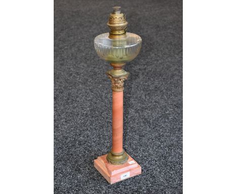 A 19th century Corinthian pink marble and scagliola columnar oil lamp, faceted urnular glass reservoir, the marbled column wi