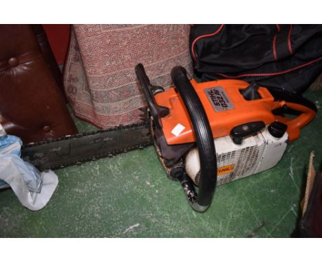 A Stihl 032AV petrol chainsaw; a petrol strimmer/bush cutter. (2)