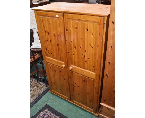 A 20th century pine double wardrobe 