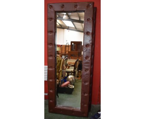 A large rectangular leather framed mirror, studded surround; another smaller (2) 