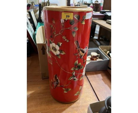 A ceramic stickstand, decorated with birds and prunus. 18½" high.